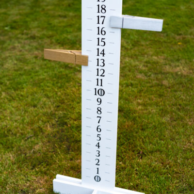 tall cornhole scoreboard with oversized clothespin point trackers