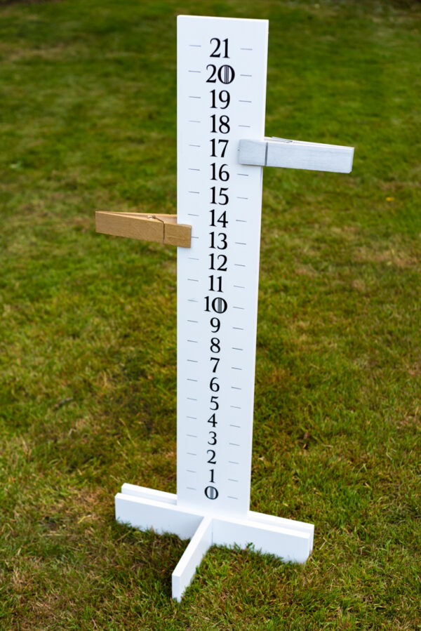 tall cornhole scoreboard with oversized clothespin point trackers